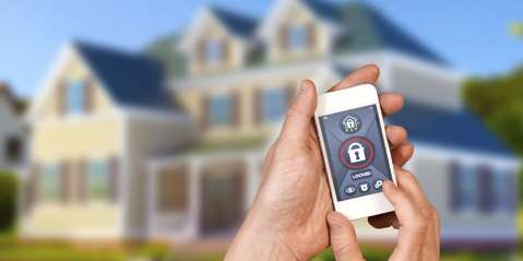 Man unlocking lock with smartphone