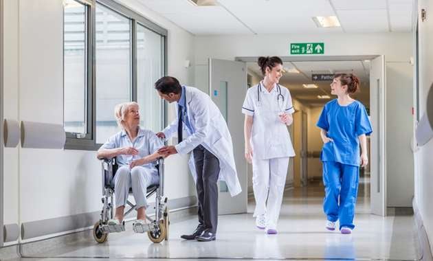 Medical staff walking through a hospital door with Trilogy Locks to keep staff, patients and patrons safe.