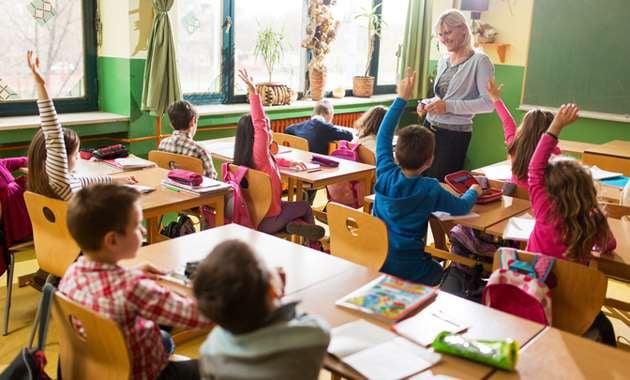 A class of elementary school students learning in a classroom secured by keyless locks.