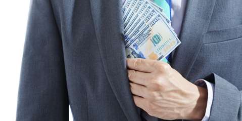 Man pulling money for coat