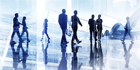 Silhouettes of Business People Walking Inside the Office