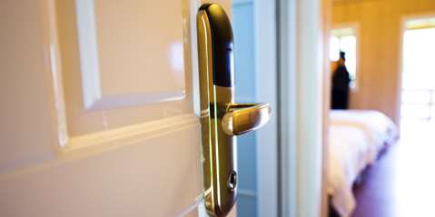 Brass lever hotel lock on open door