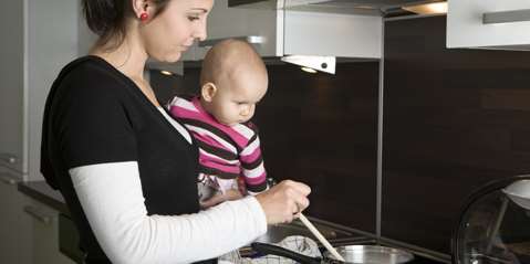 Baby looking into pot
