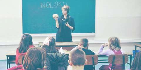 Teacher teaching biology to kids