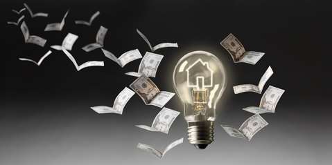 Lightbulb and money folded into birds