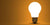 Shining arbitrary light bulb on orange